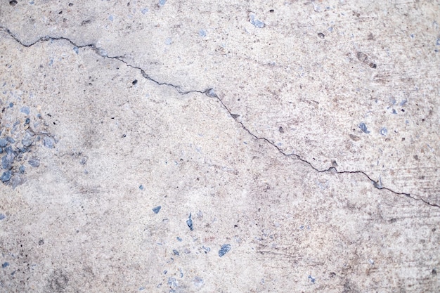Alter Betonboden In schwarz-weißem Zement gebrochene schmutzige Hintergrundtextur