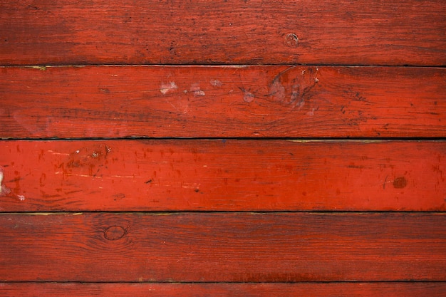 Alter roter hölzerner Hintergrund. Textur der Holzbretter