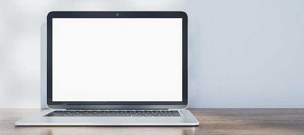 Ampla imagem do laptop com tela branca vazia colocada na parede de concreto de mesa de madeira com sombras no fundo renderização 3D