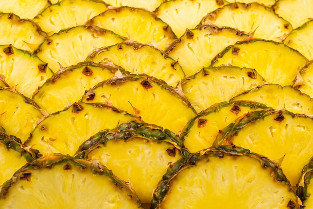 Ananas saftige gelbe Scheiben Hintergrund Draufsicht