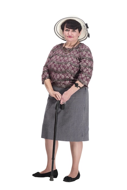 Anciana con un bastón en un sombrero de verano
