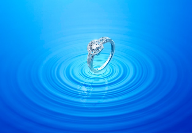 Anillo de diamantes en agua ondulada con reflejo