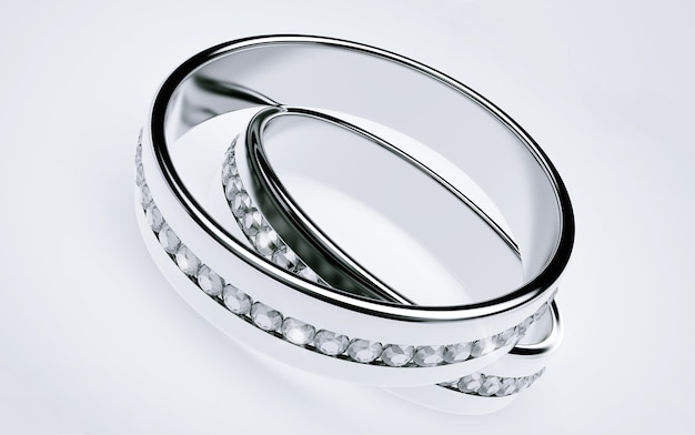 Anillos de boda de platino con diamantes sobre un fondo blanco.