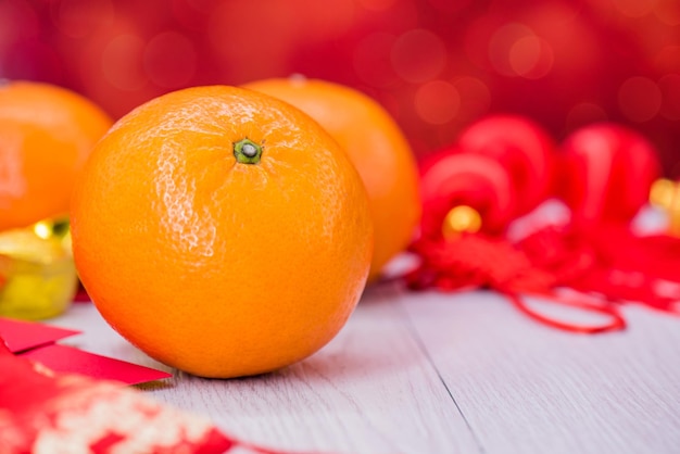 Año nuevo chino, lingotes de oro naranja y chino, estilo asiático tradicional (texto extranjero significa bendición y suerte)
