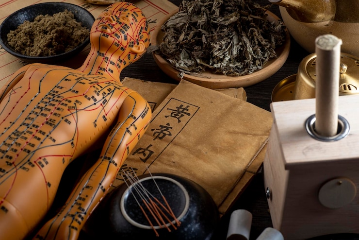 Foto antecedentes da moxabustão e fitoterapia chinesa