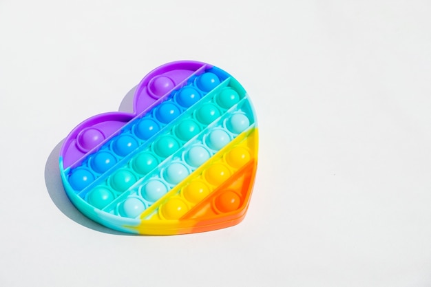 Antiestrés pop it juguete arco iris sensorial fidget aislado. nuevo juguete de silicona de moda