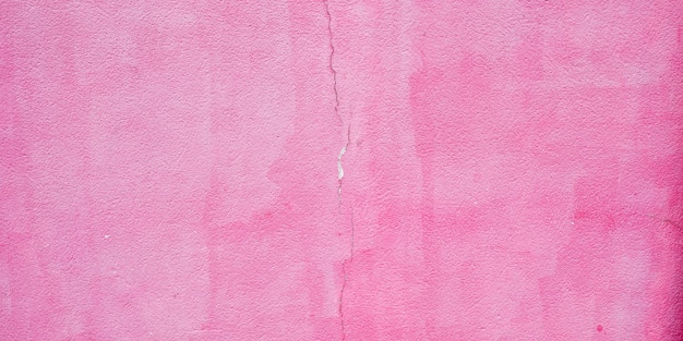 Antiga parede de fachada exterior de superfície cor-de-rosa antiga com fundo de grunge de papel de parede de textura de rachadura