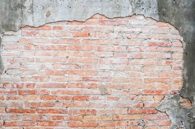 Antigo fundo de parede de tijolo vintage de concreto rachado, plano de fundo texturizado, padrão de parede de tijolo antigo, para plano de fundo