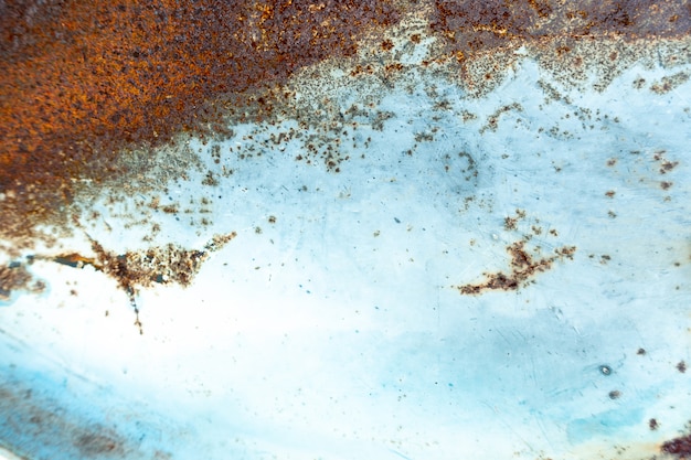 Antigo fundo vintage grunge: superfície de metal enferrujada com textura de lasca e rachaduras de tinta azul