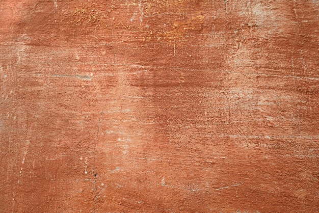 Foto antigua muralla de cemento de un edificio con pintura agrietada fondo envejecido y textura