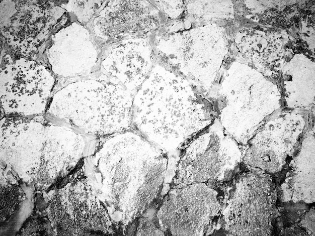 Antiguo fondo rústico restaurado en blanco y negro antiguo muro de piedra varios tonos de gris