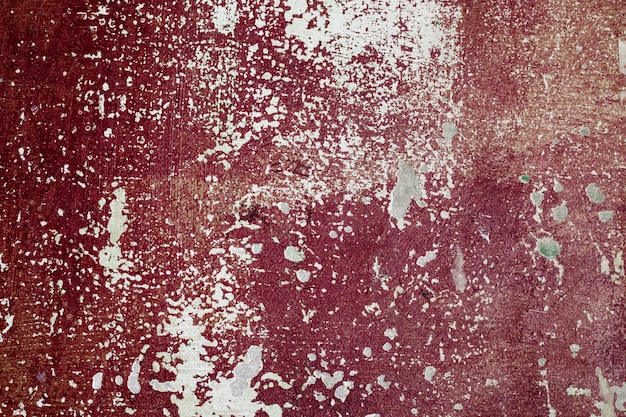 Antiguo muro de hormigón coloreado con pintura descascarada. Textura