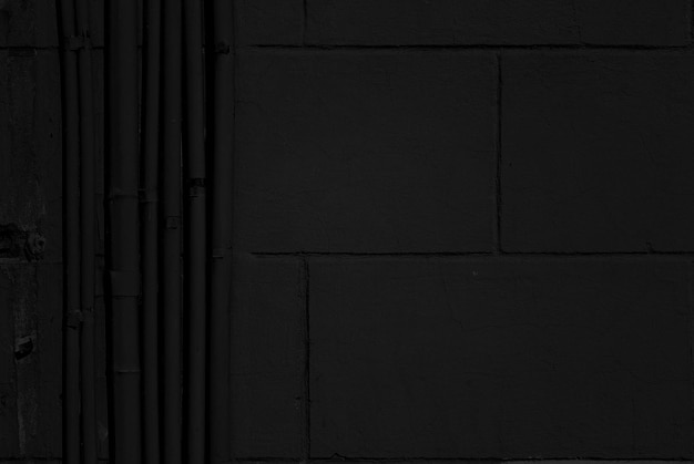 Antiguo muro de hormigón negro, fondo grunge oscuro. Textura de pizarra