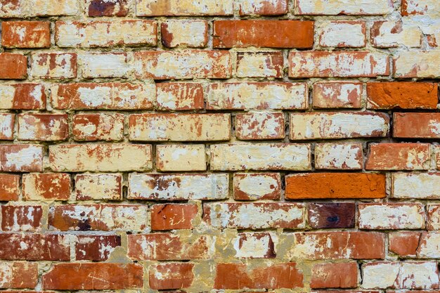 Foto antiguo muro de ladrillos rojos para el fondo