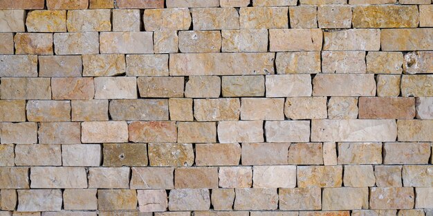 Antiguo muro marrón gris piedra cuadrada de fondo grunge horizontal de ladrillo medieval