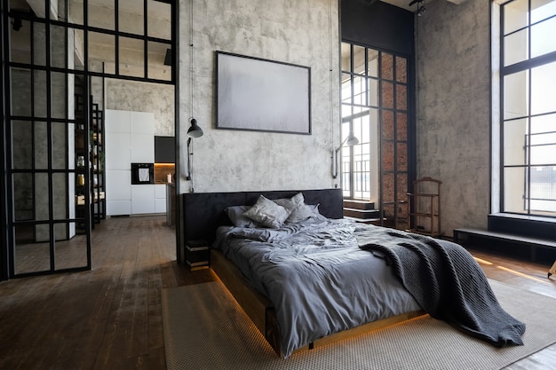 Foto apartamento de luxo em estilo loft em cores escuras. quarto moderno e elegante