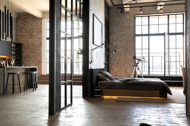 Apartamento de luxo em estilo loft em cores escuras. Quarto moderno e elegante