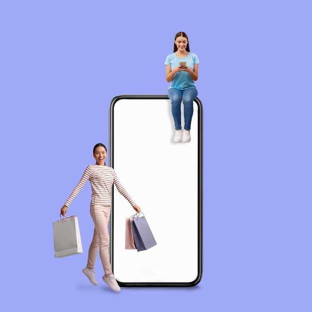 Aplicación de compras feliz mujer asiática saltando con bolsas de compras cerca de un teléfono inteligente en blanco