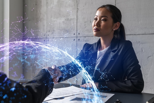 Foto apretón de manos de dos mujeres holograma de tecnología abstracta multiexposición negocios internacionales