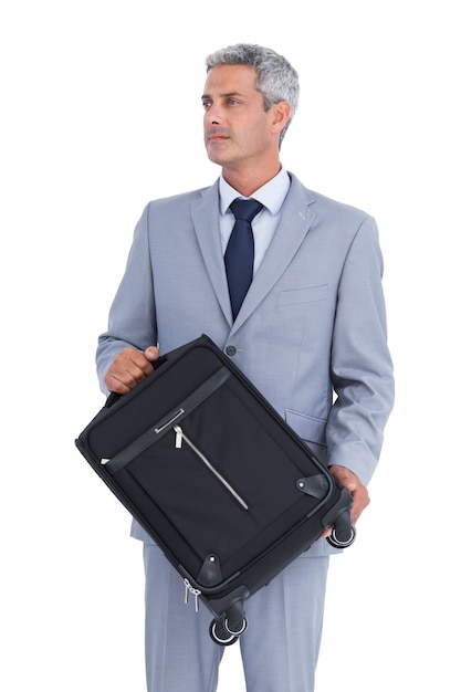 Foto apuesto hombre de negocios con maleta