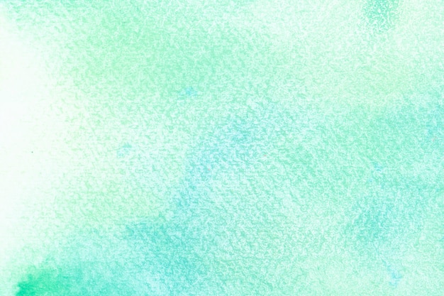 Foto aquarela azul abstrata sobre fundo branco. os salpicos de cor no papel. é uma mão desenhada.