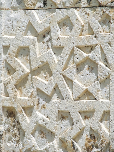 Arabesken auf Stein Altes orientalisches türkisches Muster an der Wand Stone Texture