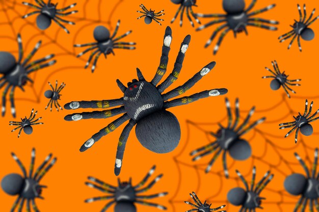 Aranhas negras em um fundo laranja Tema de Halloween Banner de cartaz