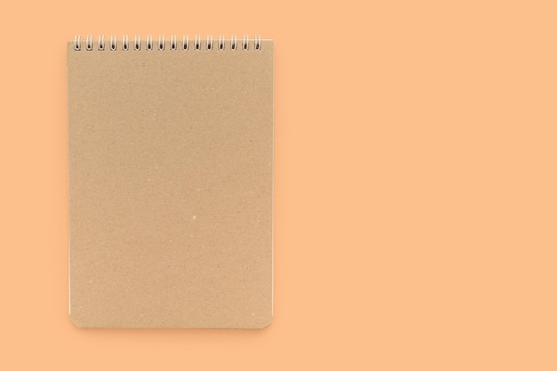 Arbeitsnotizbuch für Notizen auf beigem Hintergrund Platz für Text