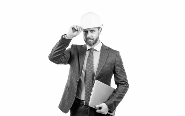 Architekt, der am Projektchefingenieur in Hardhat arbeitet, hält Computer, reifen CEO-Mann