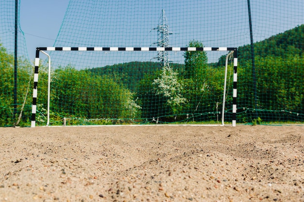 Arena en el fondo de la portería de fútbol Beach Soccer