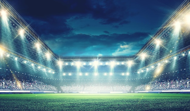 Arena de fútbol de noche completa en luces y destellos