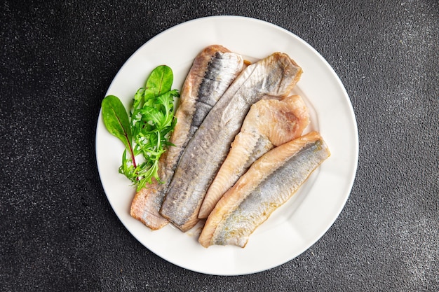 arenque filé de peixe salgado frutos do mar frescos refeição saudável comida lanche na mesa cópia espaço comida