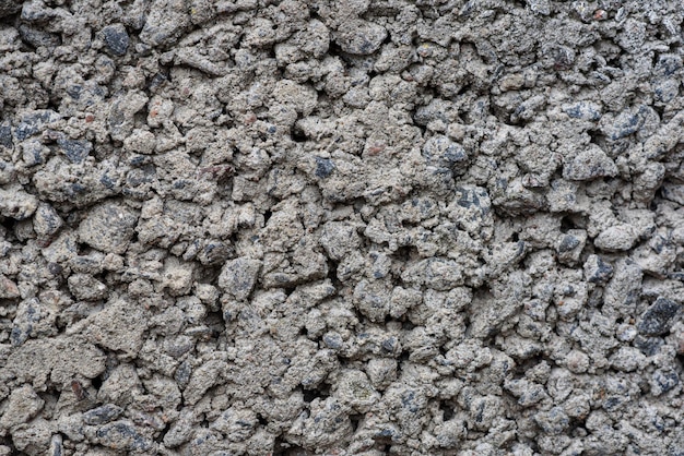 Argamassa de concreto solidificado textura com fundo de pedras