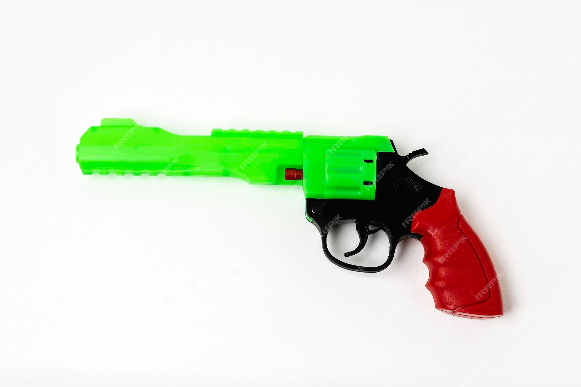 Uma Arma Colorida Da Mão Da Pistola Do Brinquedo Foto de Stock - Imagem de  revestimentos, fundo: 121015934