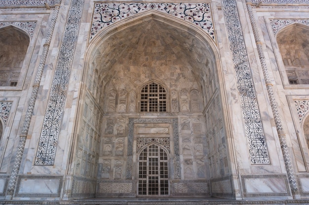 Arqueie o Taj Mahal e a textura do edifício Agra, Índia. O Taj Mahal é amplamente reconhecido como a joia da arte muçulmana e uma das obras-primas do mundo universal