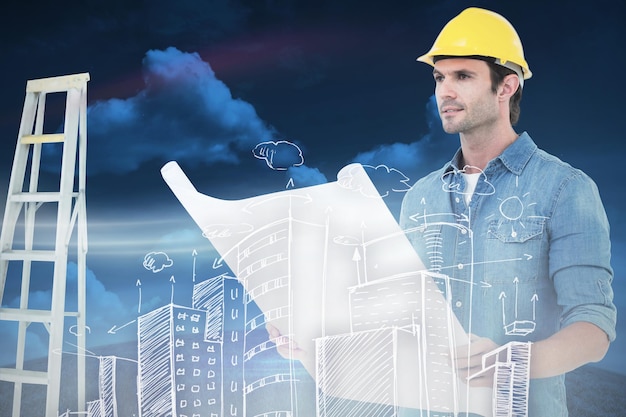Arquitecto sosteniendo blueprint en casa contra campo verde bajo un cielo azul