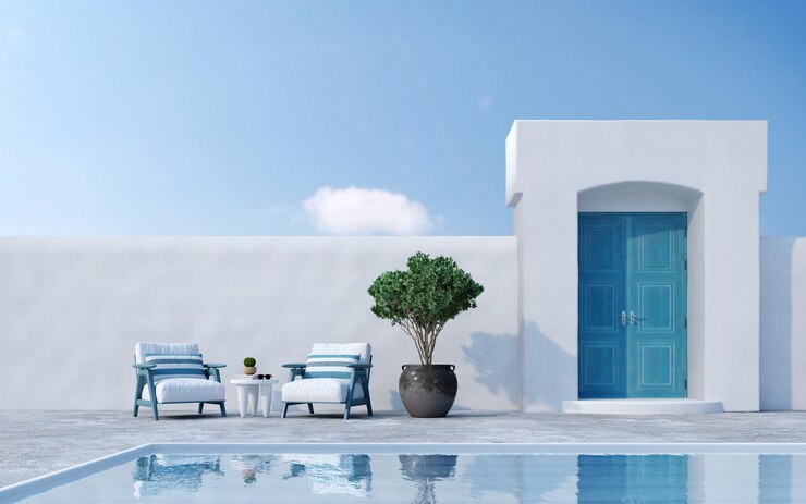 Arquitectura de estilo Santorini con sillones puerta de planta y piscina