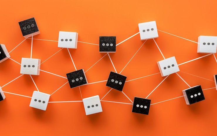 Foto un arreglo minimalista de bloques de madera blancos y negros con puntos conectados por líneas en un fondo naranja