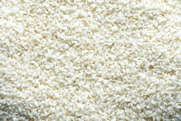 Foto arroz basmati orgânico cru branco. ingrediente alimentar. vista superior, conceito de estilo de vida saudável.