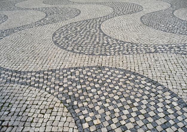 Arte en la calle, pavimento de adoquines en Lisboa, Portugal
