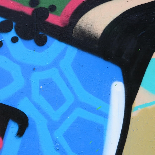 Arte de rua Imagem de fundo abstrata de um fragmento de uma pintura de graffiti colorida em tons azuis