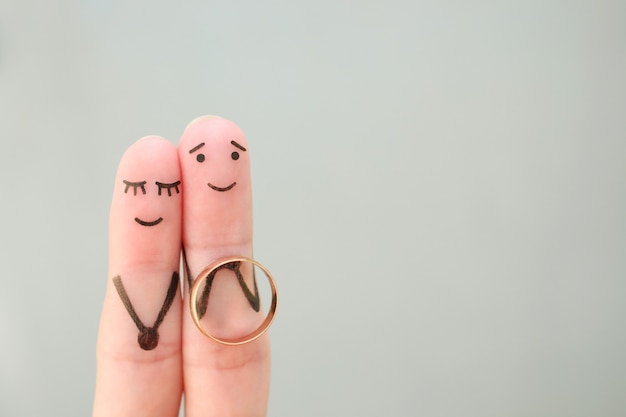 Arte de los dedos de la feliz pareja. Concepto de hombre proponiendo a mujer.