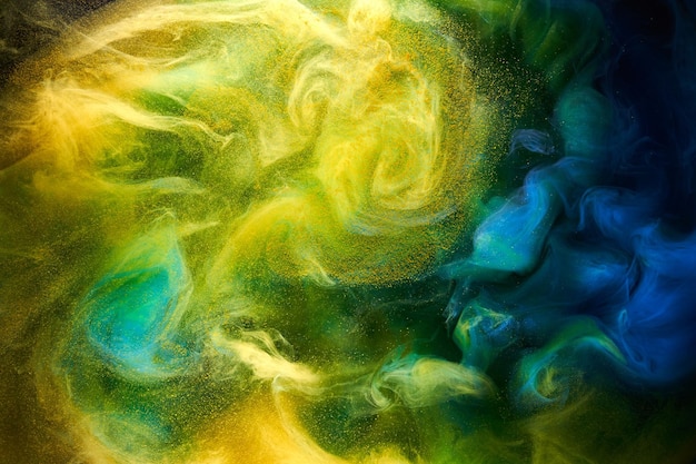 Arte fluida líquida Fundo abstrato Azul amarelo dançando tintas acrílicas debaixo d'água oceano espaço fumaça