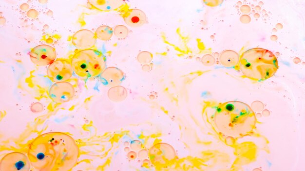 Arte fluido Fondo multicolor con aceite sobre líquido Fondo rosa dorado abstracto