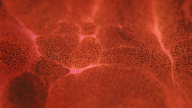 Arte lava líquida brilla flujo de pintura desenfocado rojo oscuro coral bronce rosa marrón color magma fluido