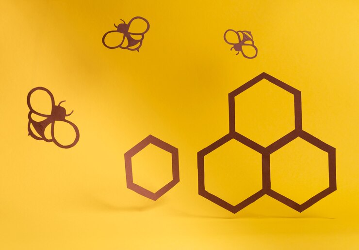 Foto arte de papel con abejas cortadoras de papel y panales dulces saludables concepto de alimentos orgánicos