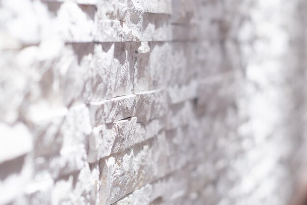 Arte de pared de ladrillo blanco y negro con textura de hormigón o piedra de fondo en blanco borroso