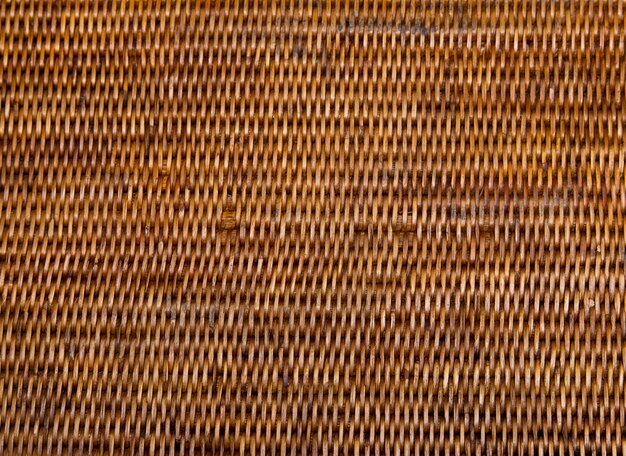 Artesanato tecelagem de bandejas de cesta de vime. A natureza de bambu da tradição tailandesa textures o fundo.