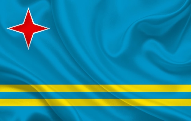 Foto aruba-landesflagge auf gewelltem seidenstoff-hintergrundpanorama - illustration