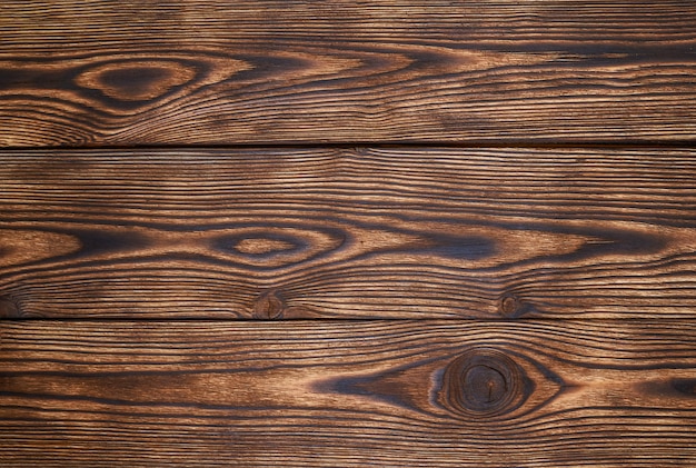As pranchas de madeira bronzeiam o teste padrão e a textura bonitos para o fundo. Fundo de madeira
